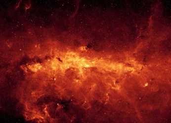 Centre de la galaxie de la Voie lactée vu par le télescope spatial Spitzer. Image infrarouge du centre galactique et des nuages de poussière, illuminés par de jeunes étoiles massives. Crédit NASA. Science Astronomie Espace